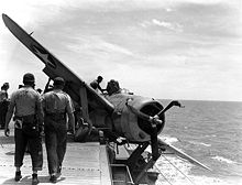 F2A3 of VMF-211 with collapsed landing gear on board USS "Long Island"